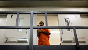 An inmate watches from his cell as DC Mayor Muriel Bowser tours DC Central Jail after announcing policy changes to support employment for inmates during and after incarceration in Washington...