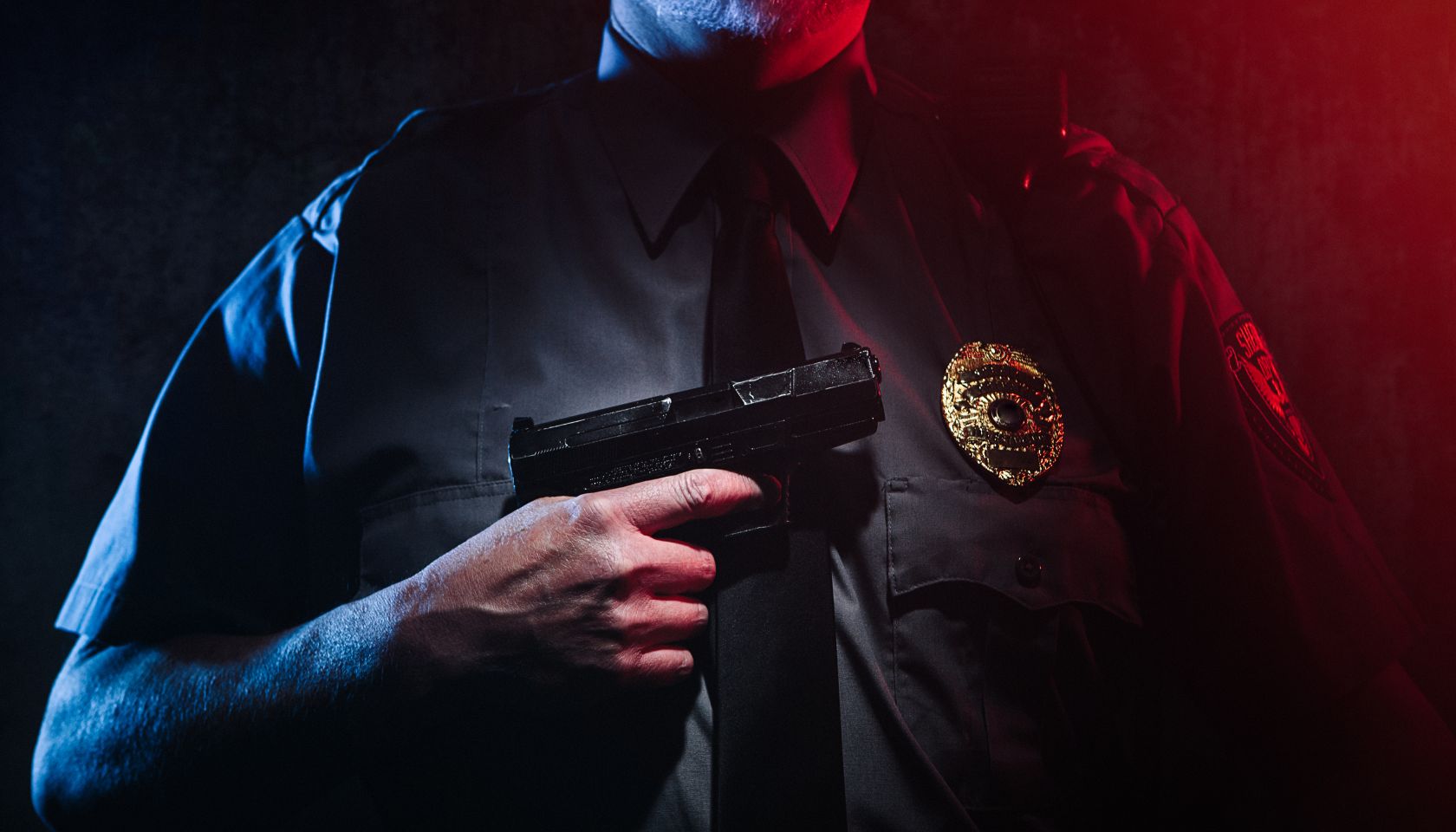 Police Officer Holding Gun