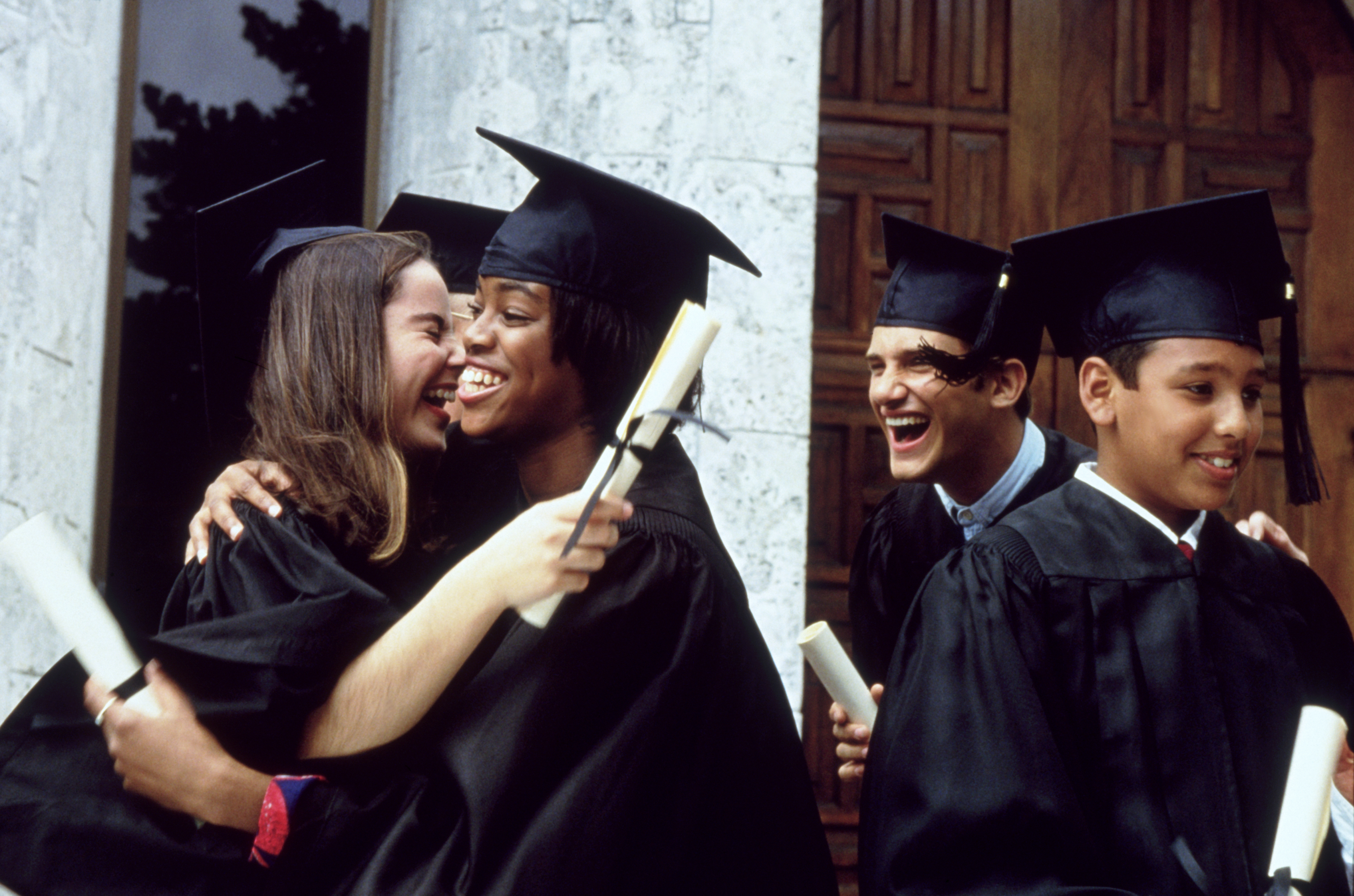 Graduates celebrating after commencement