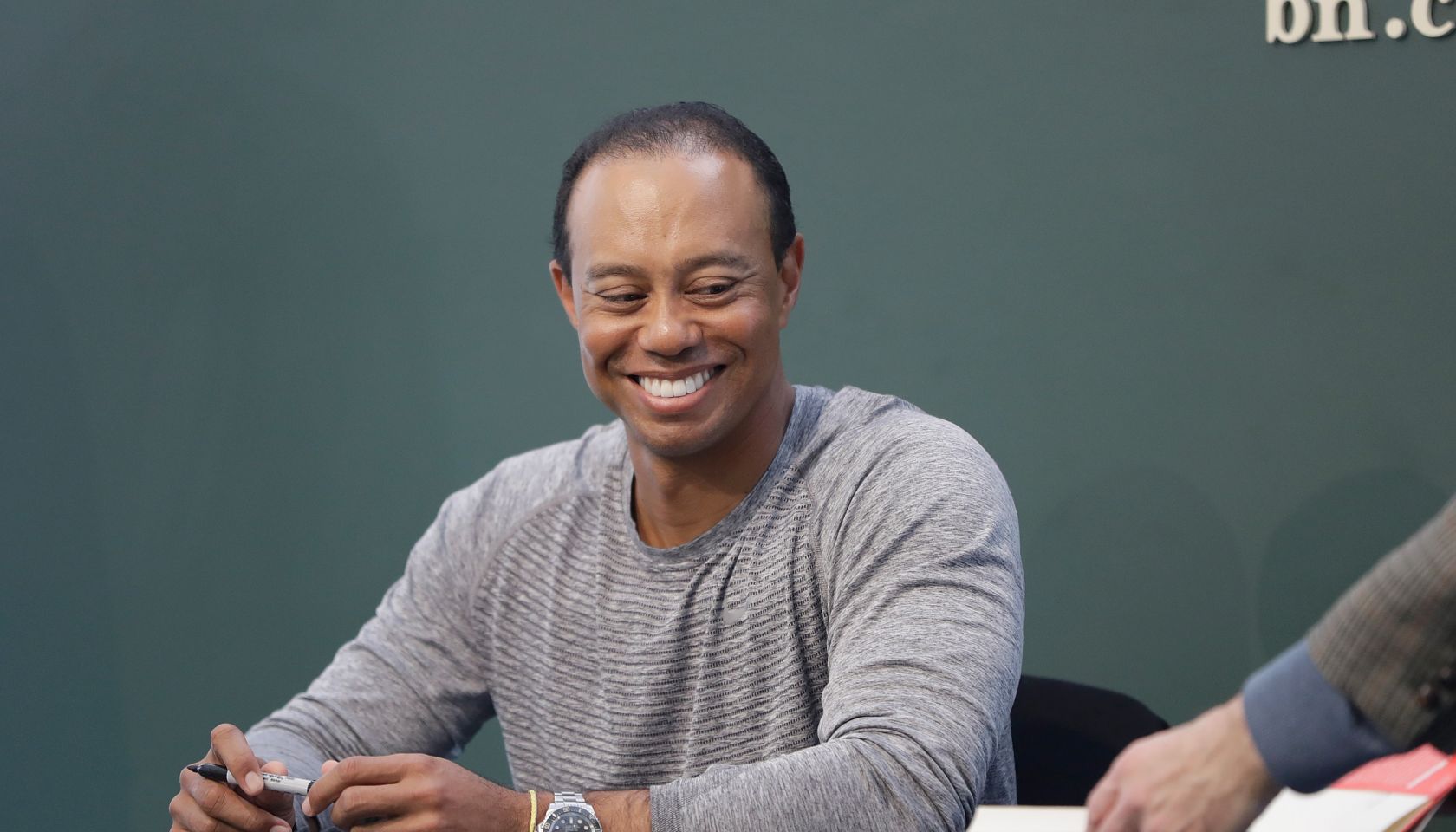Tiger Woods Signs Copies Of His New Book 'The 1997 Masters: My Story'