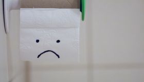 Sad Anthropomorphic Face On Toilet Paper