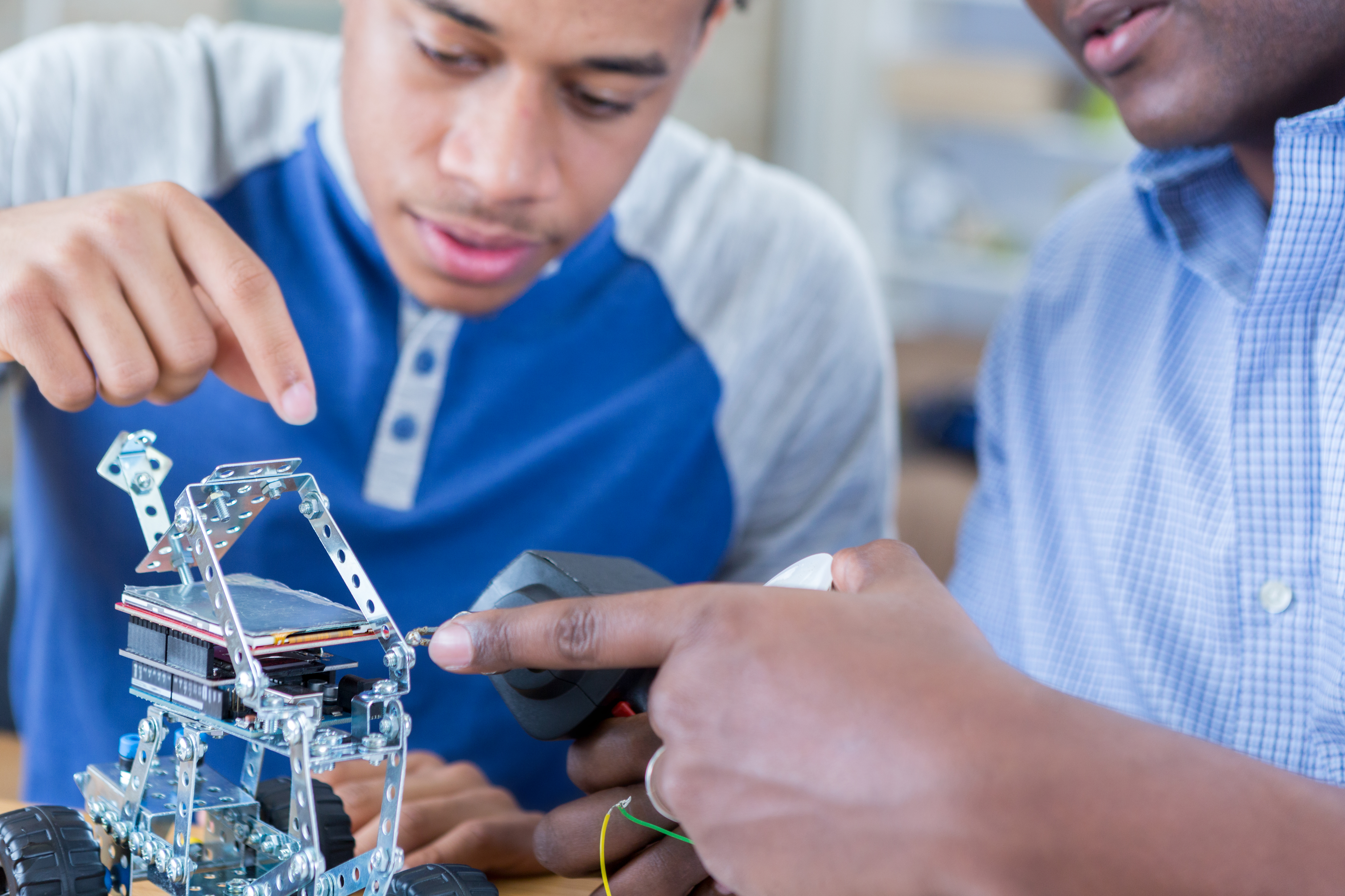 Father and son build robotic vehicle together