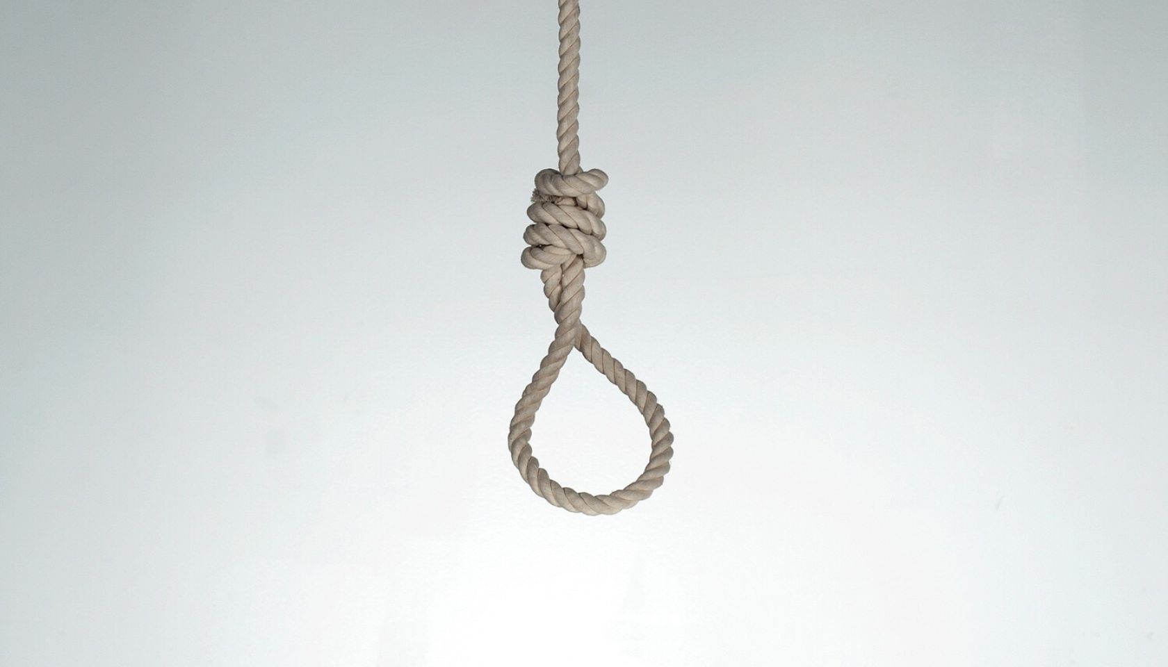 Low Angle View Of Noose Against White Background