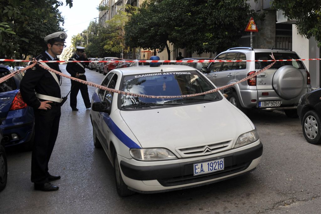 Greek police seal off an area to investi
