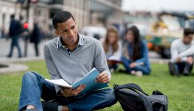 African American student studying outdoors in London