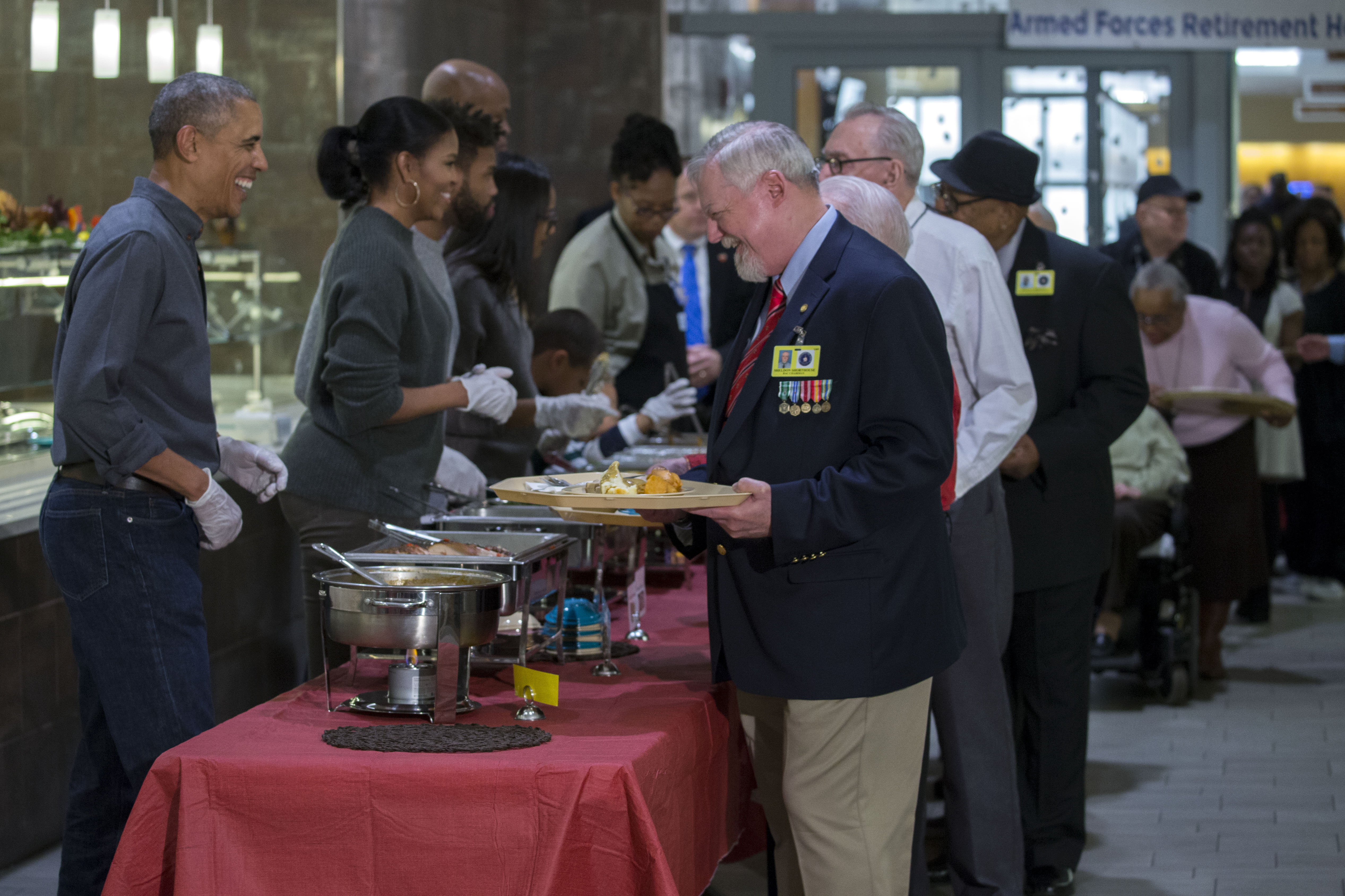 US President Barack Obama Serves Dinner At The Armed Forces Retirement Home