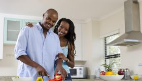 African middle class couple in the kitchen