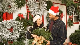 Couple choosing Christmas wreath