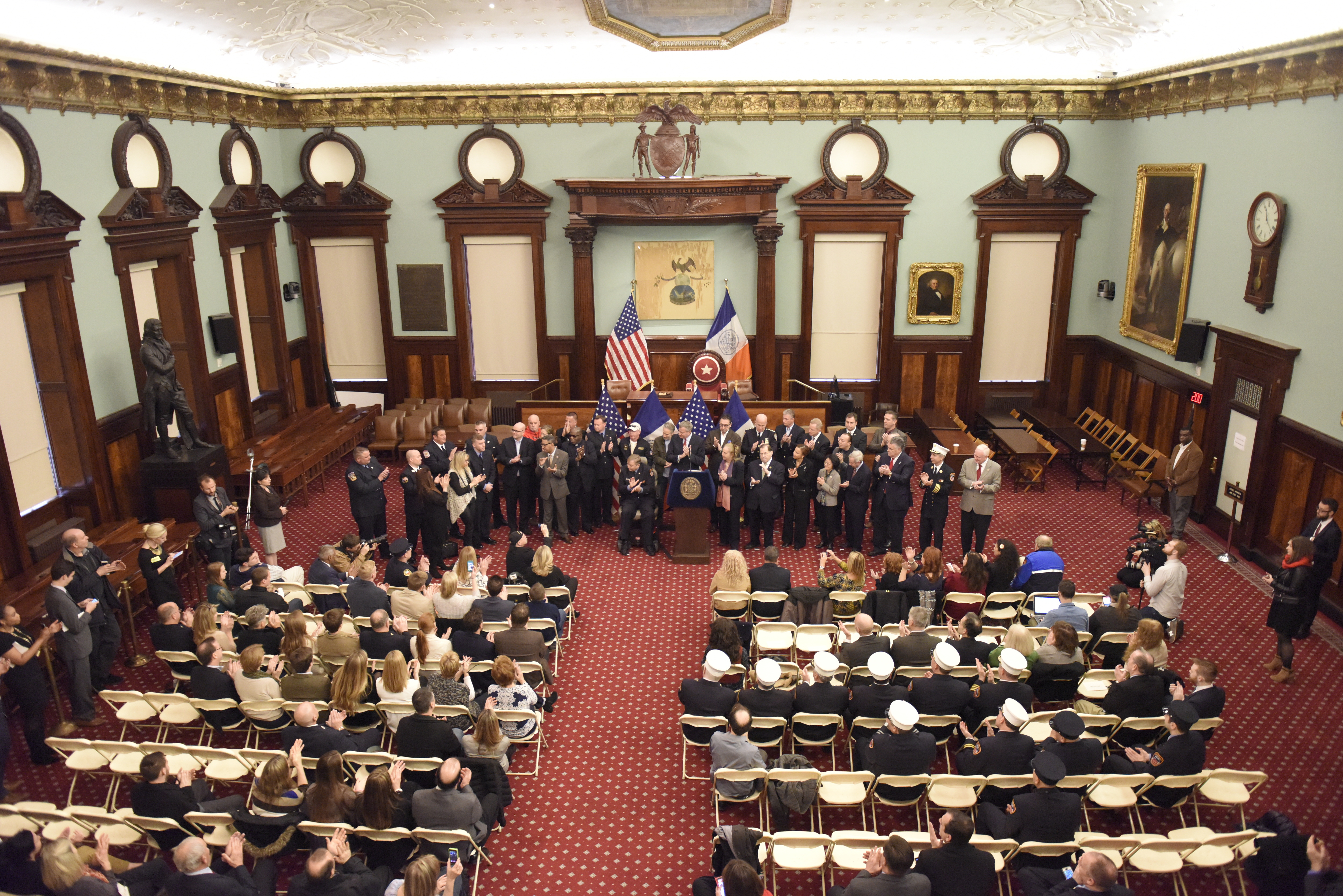 Mayor de Blasio gathered with fire fighters in city council...