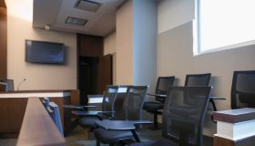 Jury box seats in empty courtroom