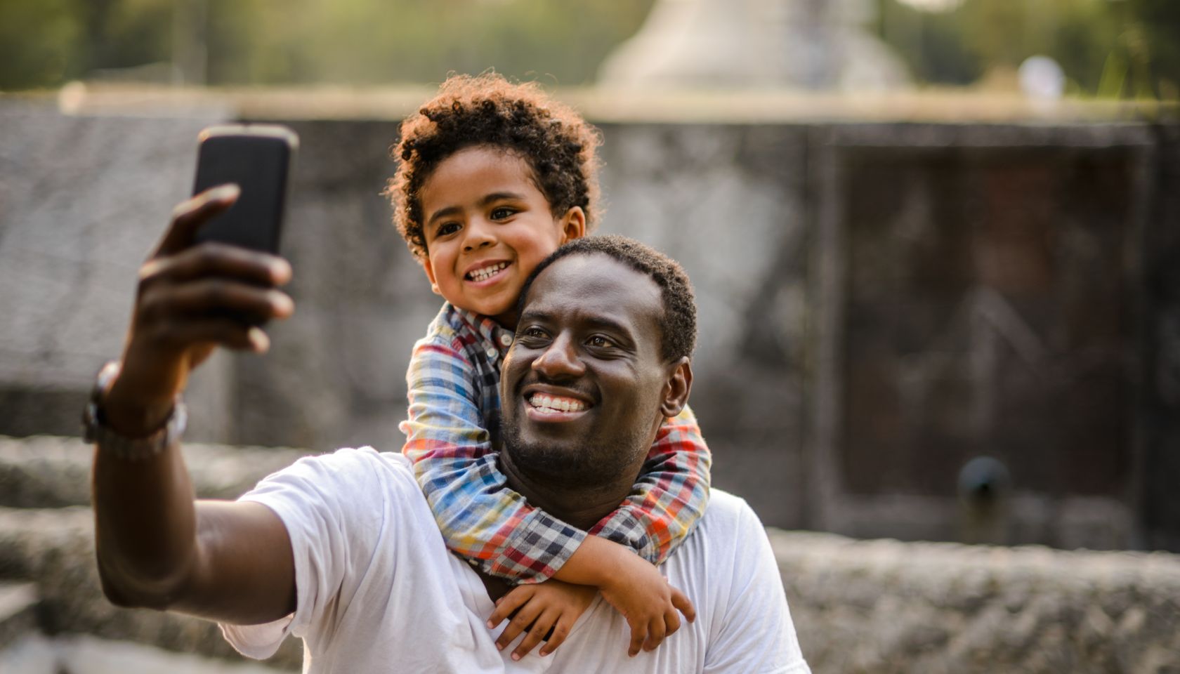 Father and son making selfie.