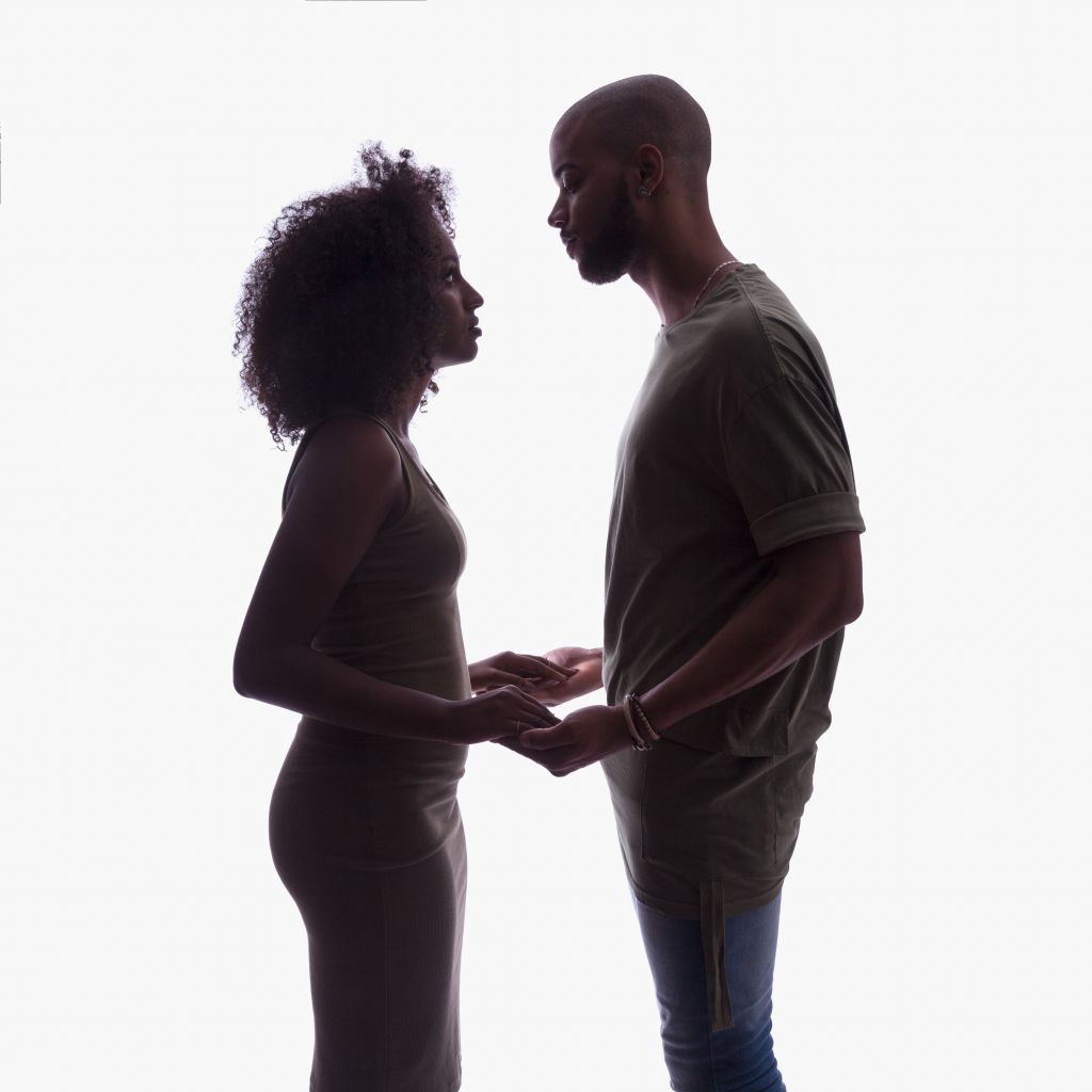 Silhouette of young couple in studio setting