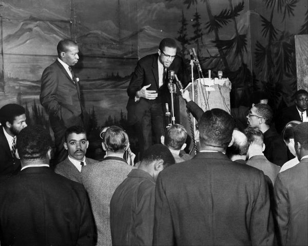 Reporters question Malcolm X during press time at Audubon Ba