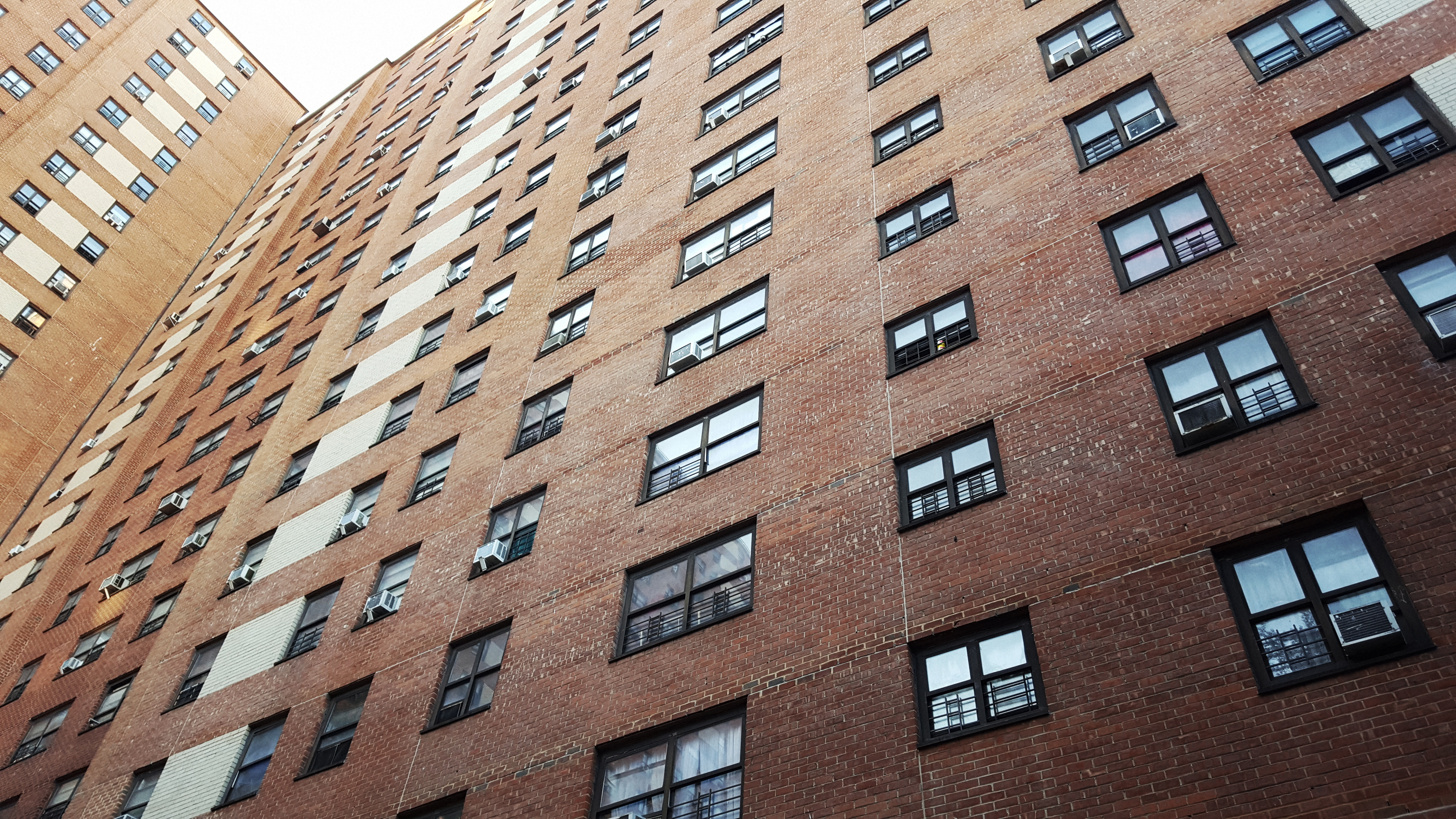 View from below of housing project at West 125th Street and Broadway in the district of Harlem, Manhattan, New York City