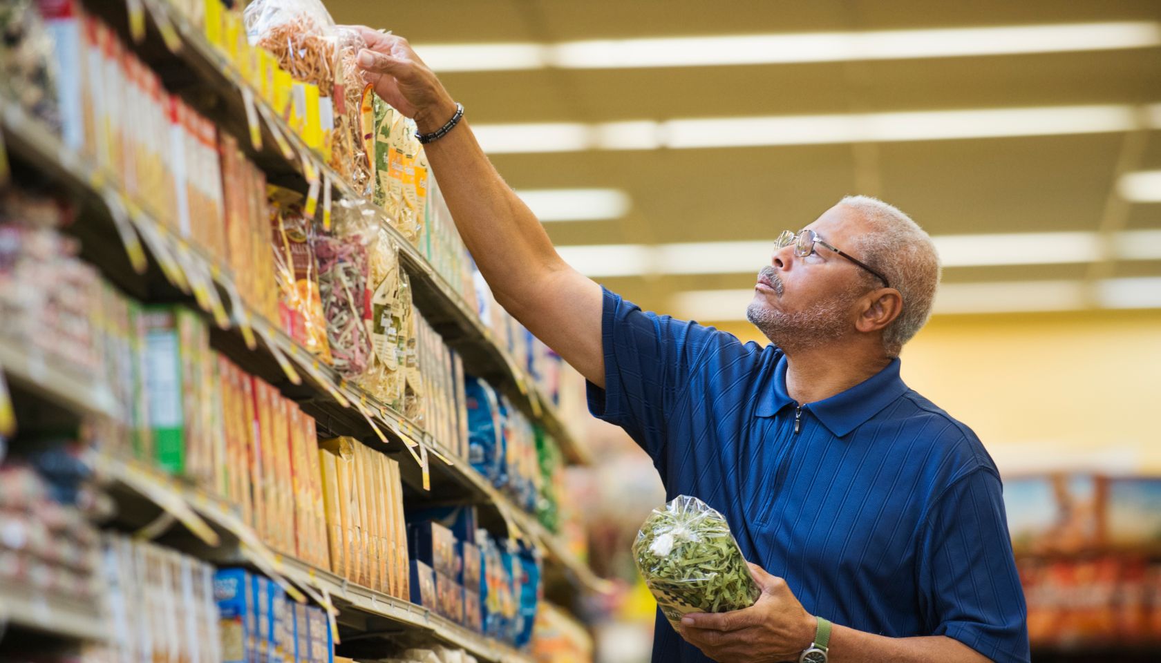 African American man shopping in grocery store