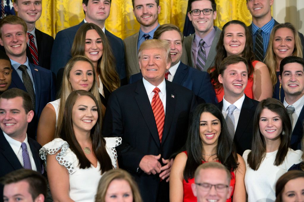 Trump Poses With Outgoing Interns