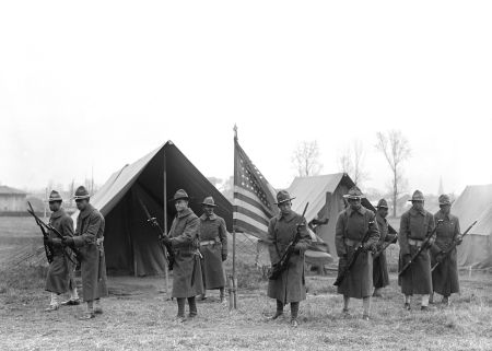 African-American Troops, Portrait Near Tents and American Flag, circa 1917