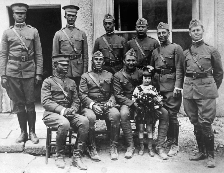 American Officers Pose With Young Girl