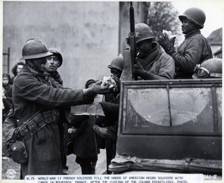 World War Ii French Soldiers Give Candy