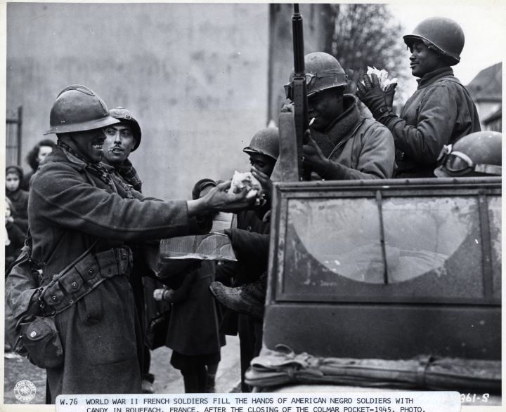 World War Ii French Soldiers Give Candy