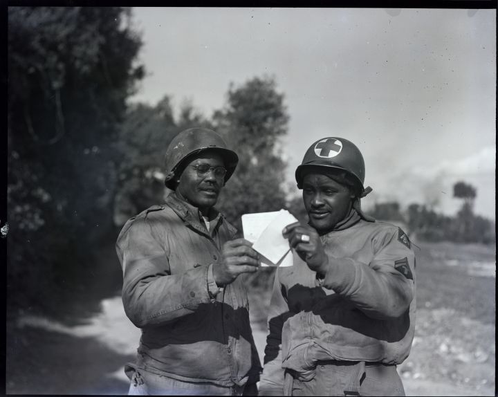 Soldiers Sharing Letter