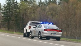 Police vehicle stop a speeding motorist on a rural highway