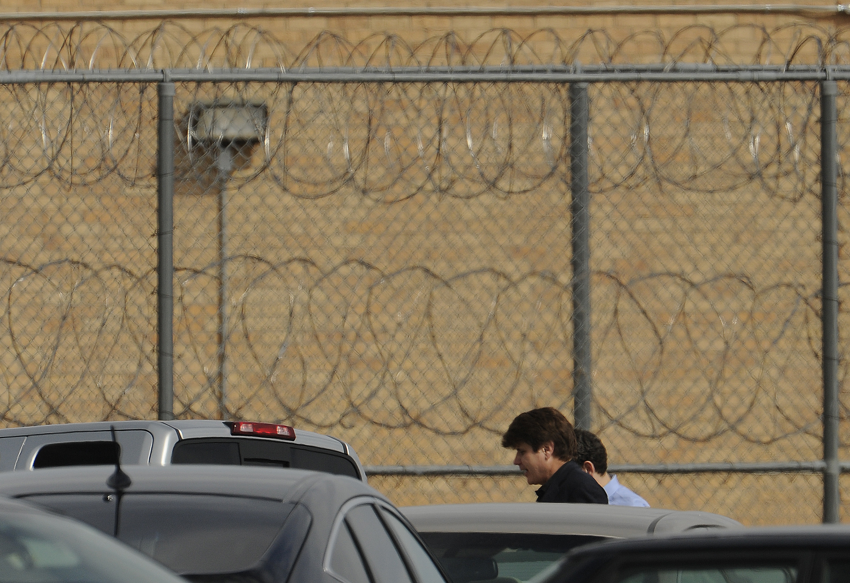 Former Illinois Gov. Rod Blagojevich with his lawyer Aaron Goldstein walks into prison in Littleton, Colorado, to begin his 14-year prison sentence on corruption charges Thursday, March 15, 2012. The 55-year-old Democrat becomes the second Illinois govern