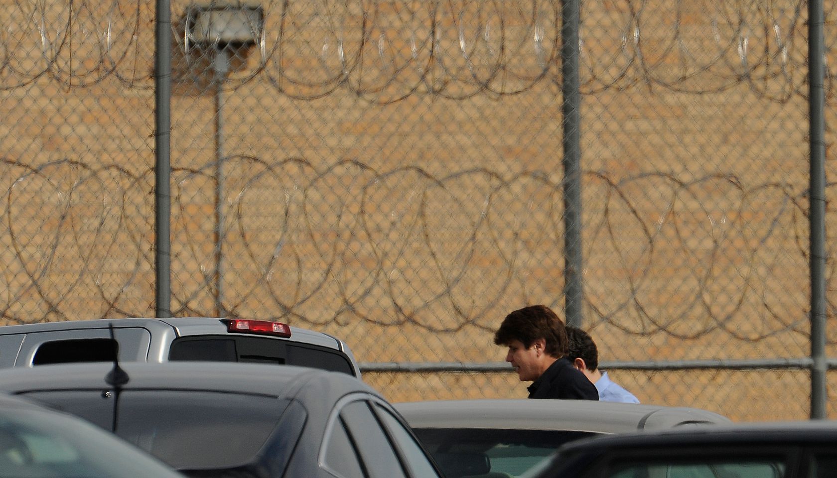 Former Illinois Gov. Rod Blagojevich with his lawyer Aaron Goldstein walks into prison in Littleton, Colorado, to begin his 14-year prison sentence on corruption charges Thursday, March 15, 2012. The 55-year-old Democrat becomes the second Illinois govern