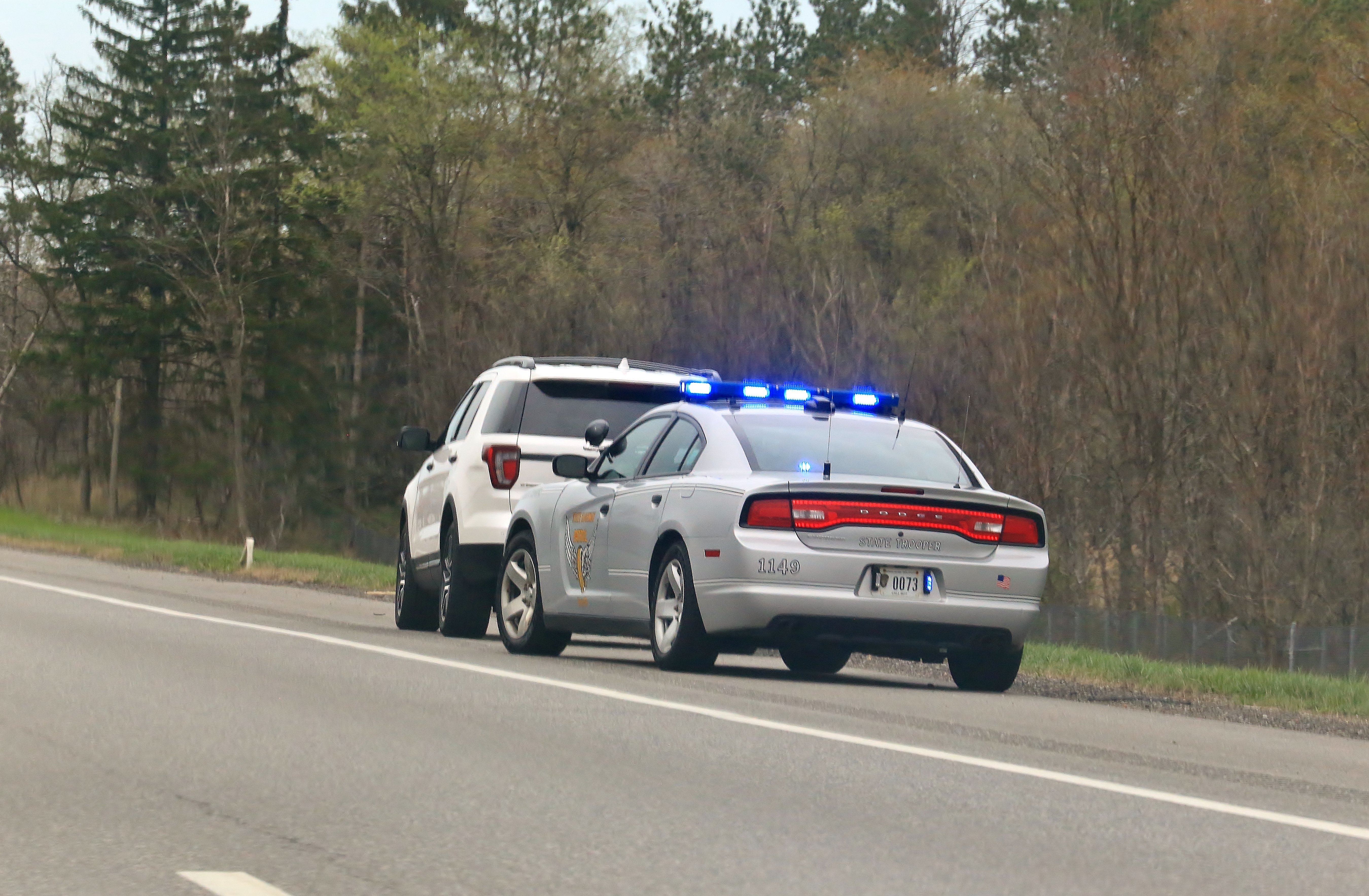 Police vehicle stop a speeding motorist on a rural highway