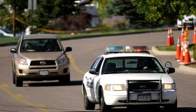 People picks up their car at the parking lot of Century Aurora 16 movie theater by the Police car escort at in Aurora, CO. Saturday, July 21, 2012. Hyoung Chang, The Denver Post