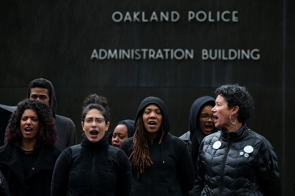Protestors Chain Themselves To Oakland PD Headquarters