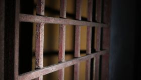 Close-Up Of Rusty Metallic Gate Prison Bars