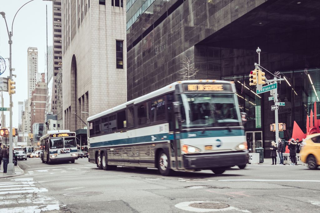 Public transportation buses on Fifth Avenue , Midtown Manhattan