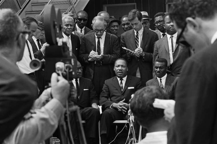 Martin L. King Seated Addressing Camera