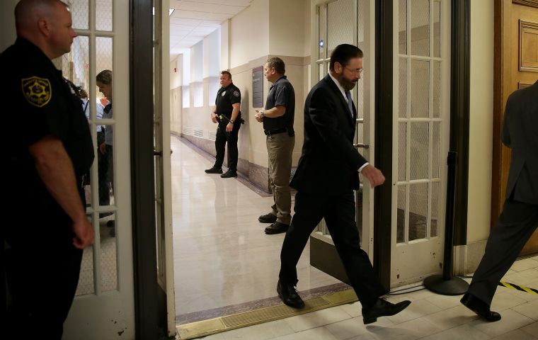 Judge Steven T. O’Neill enters the courtroom