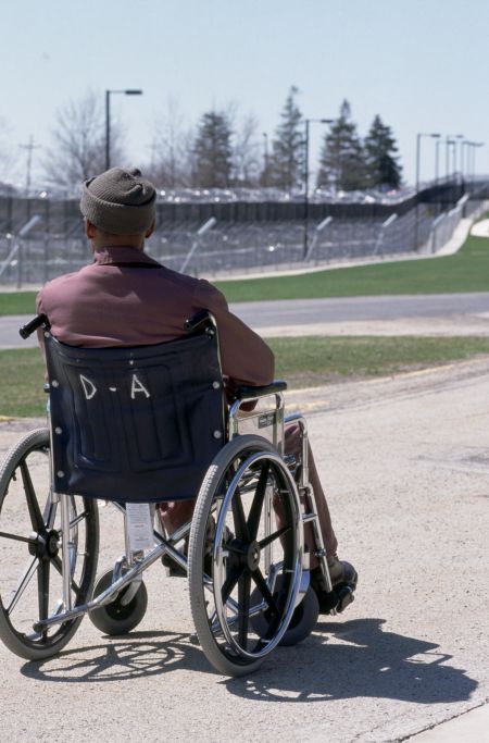 Wheelchair Bound Prisoner Gazing Across SCI Laurel Highlands Prison Yard