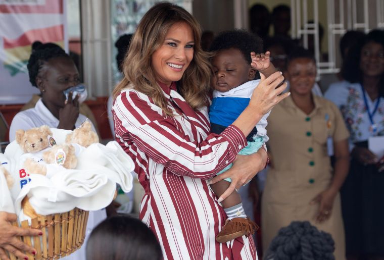 Melania Trump holds a baby