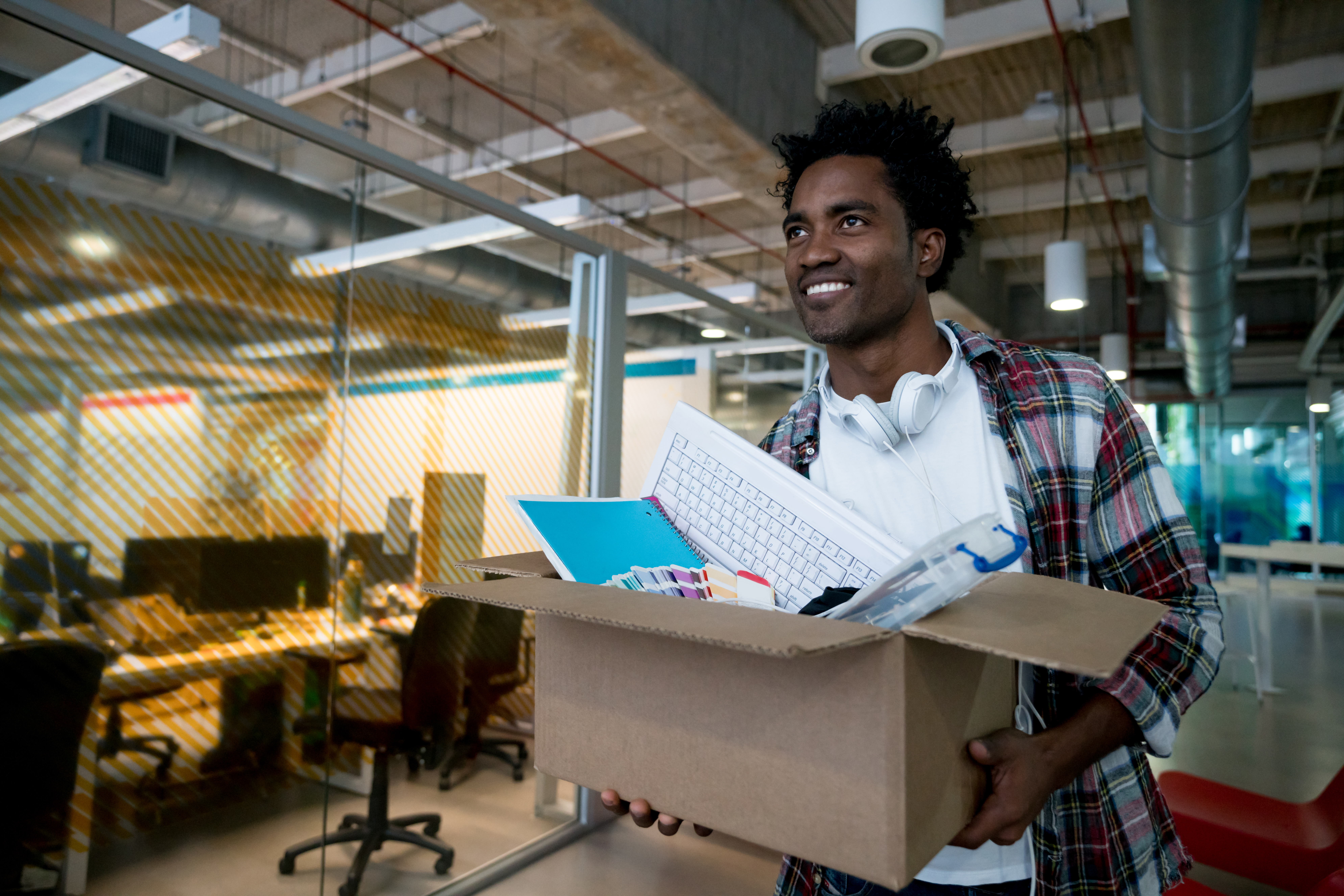 Happy man moving into a new office