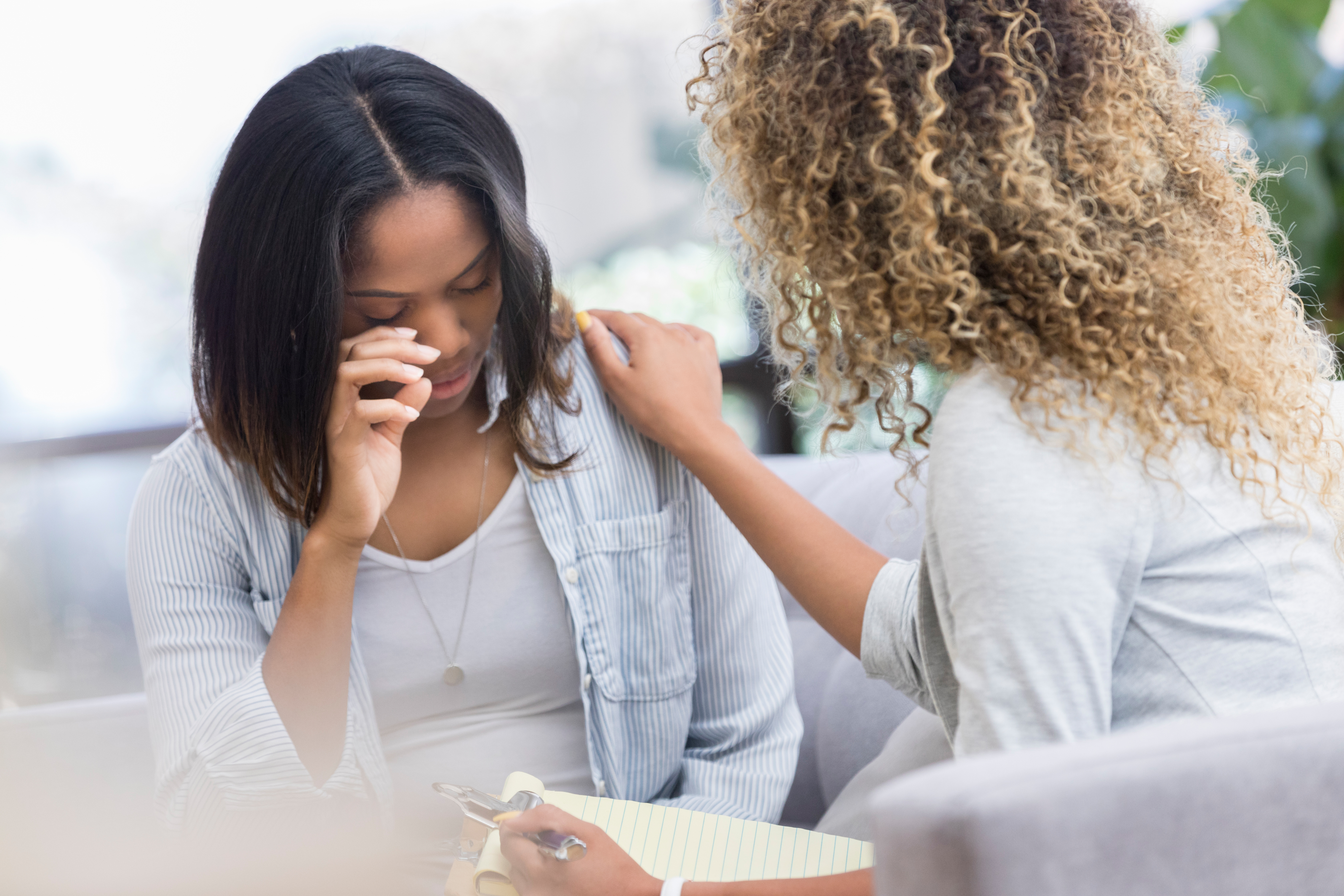 Mental health professional comforts patient