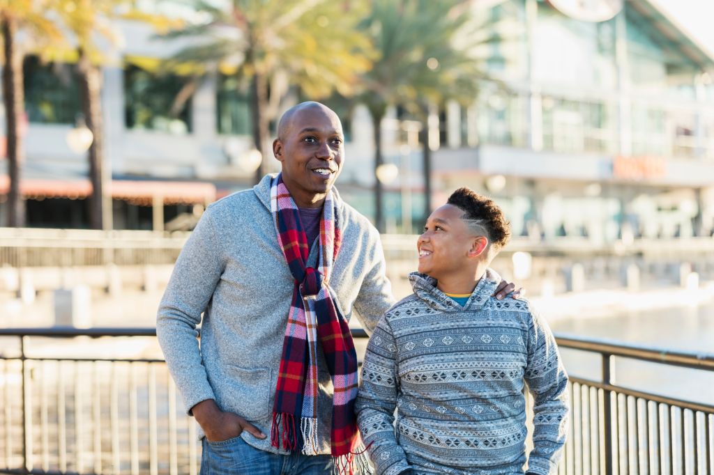 African-American father and son in city