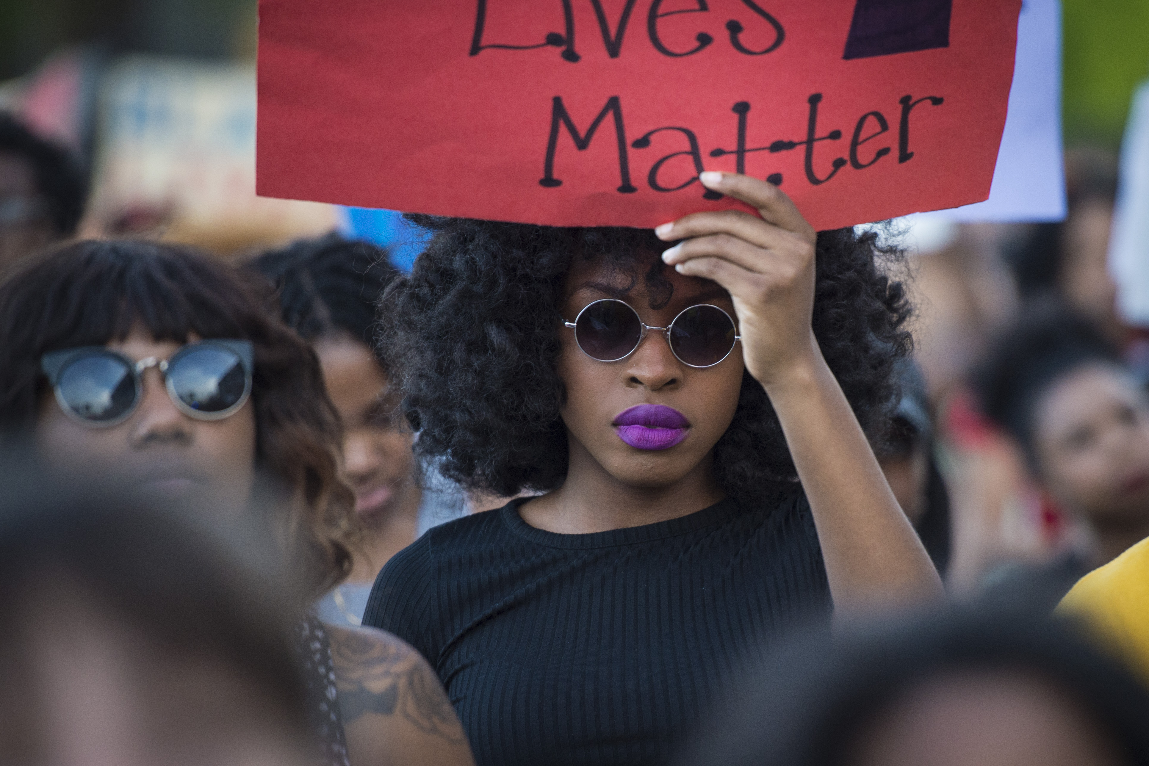 Demonstrators march in front of Baltimores Penn Station, protes