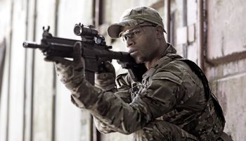 Lone African American Male soldier in outdoor setting