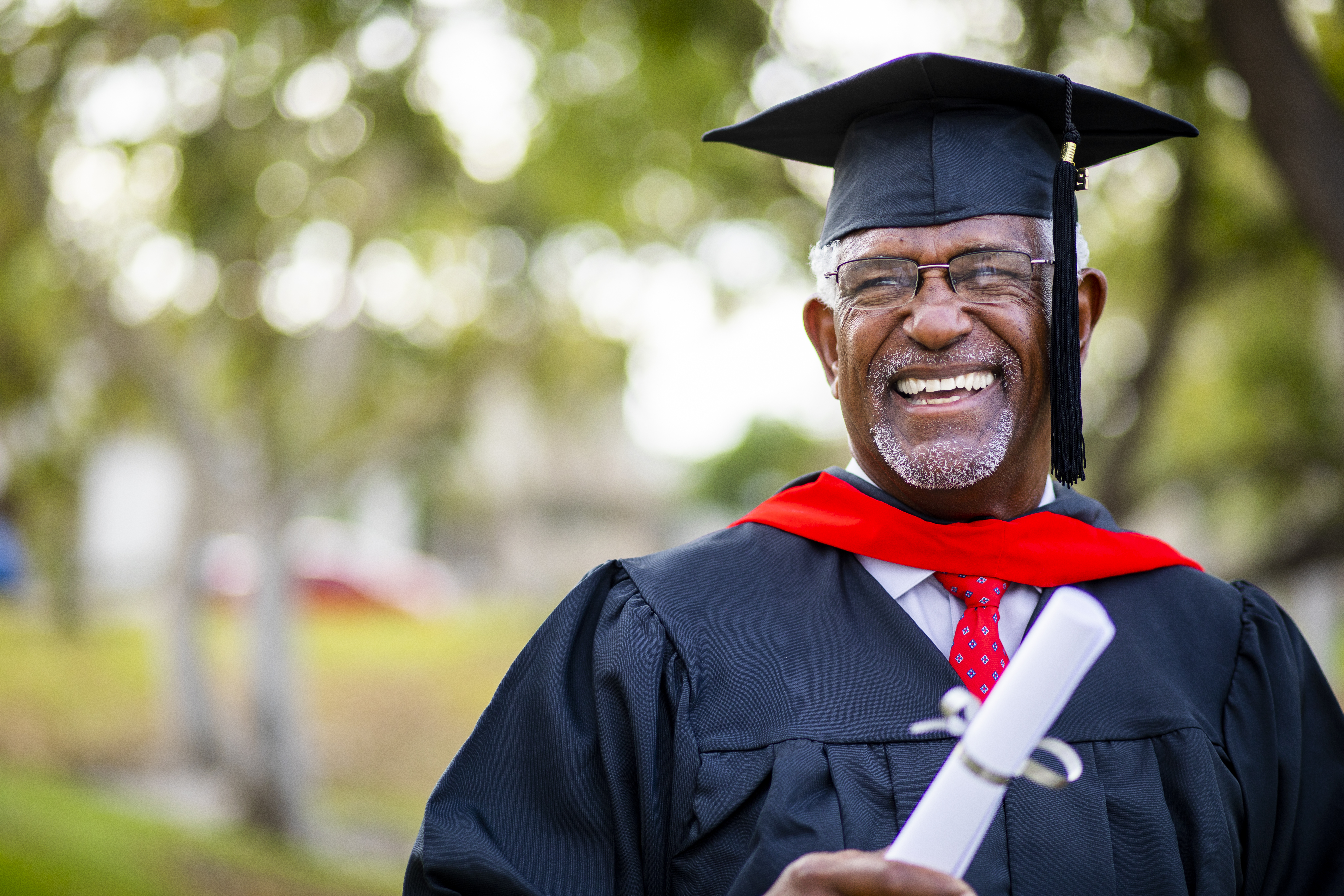 Portriat of a senior black graduate