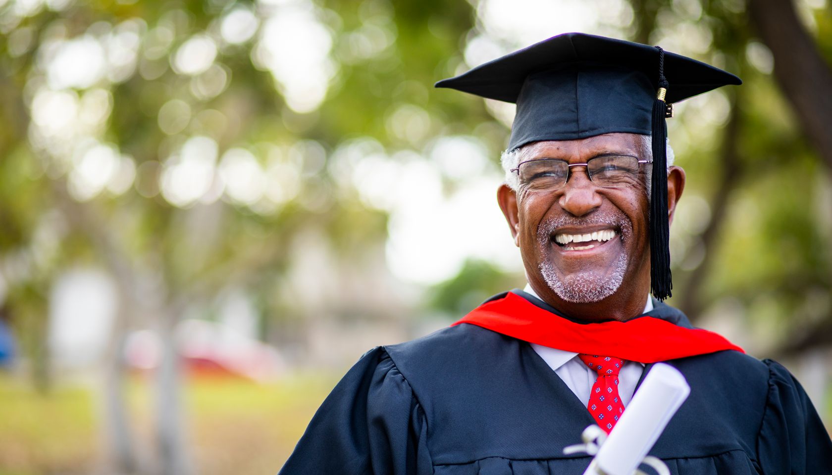 Portriat of a senior black graduate