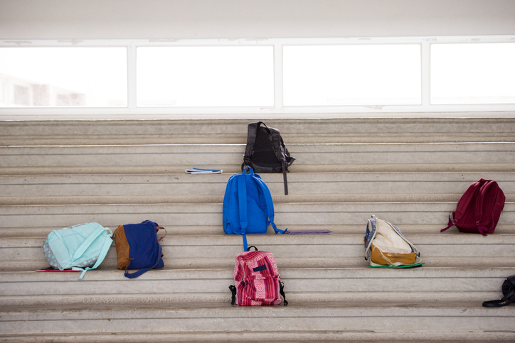 Backpacks left on bleachers