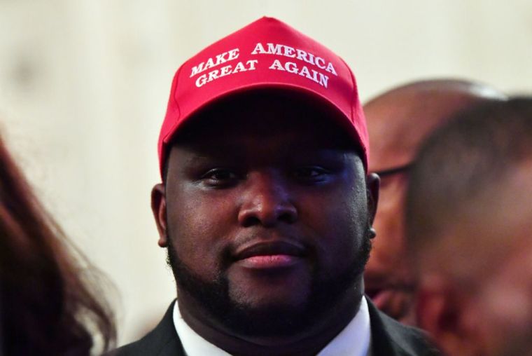 Black MAGA hat enthusiast