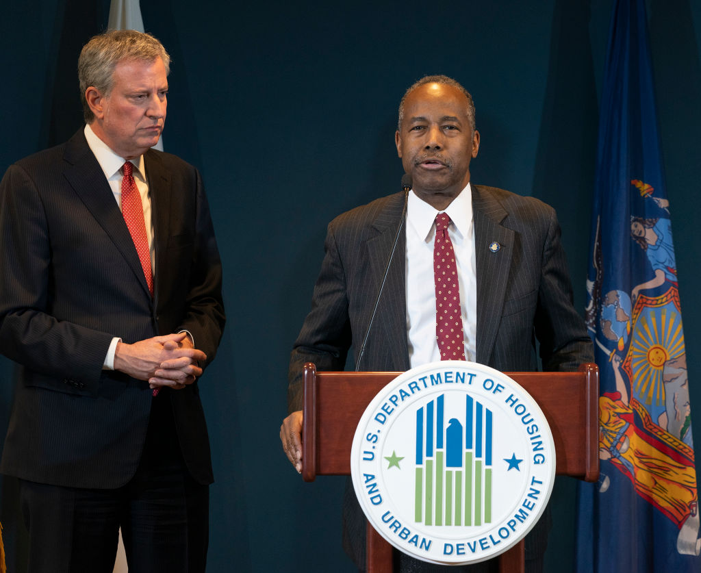 Mayor Bill de Blasio listens as Secretary of US HUD Ben...