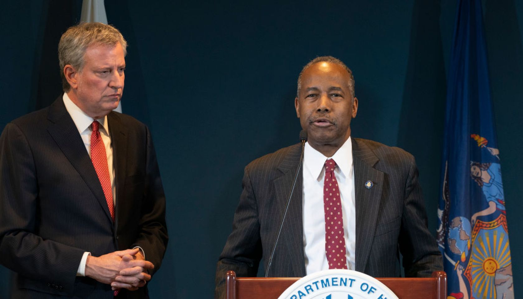 Mayor Bill de Blasio listens as Secretary of US HUD Ben...