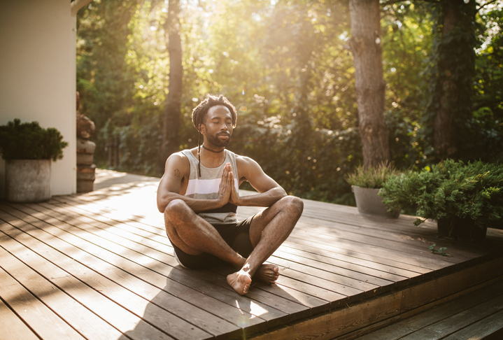 Practicing yoga on porch