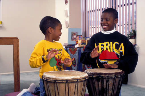 African American brothers playing drums